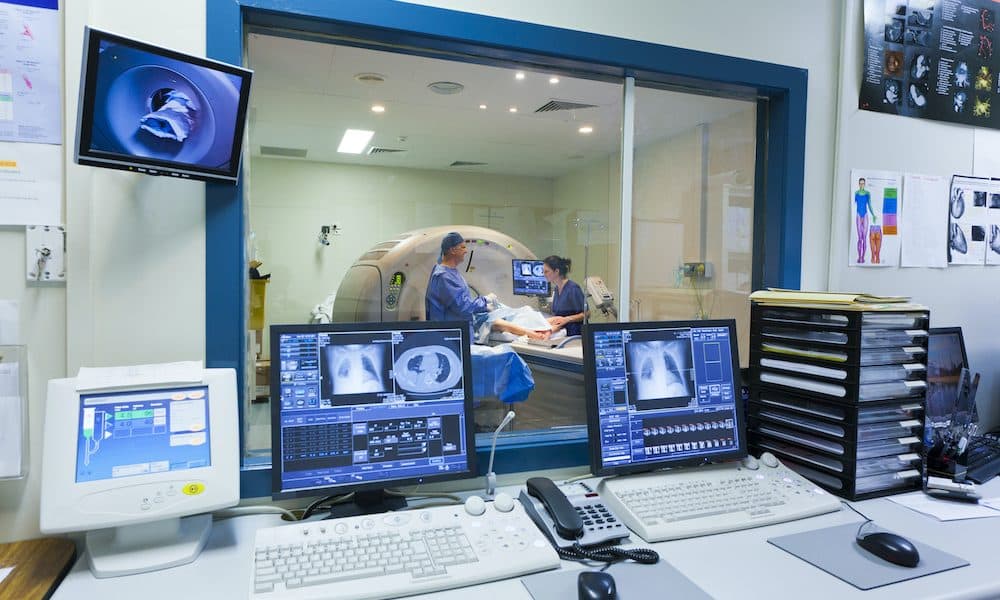 MRI machine and screens Is tech the answer to radiology’s gaping skills shortage?